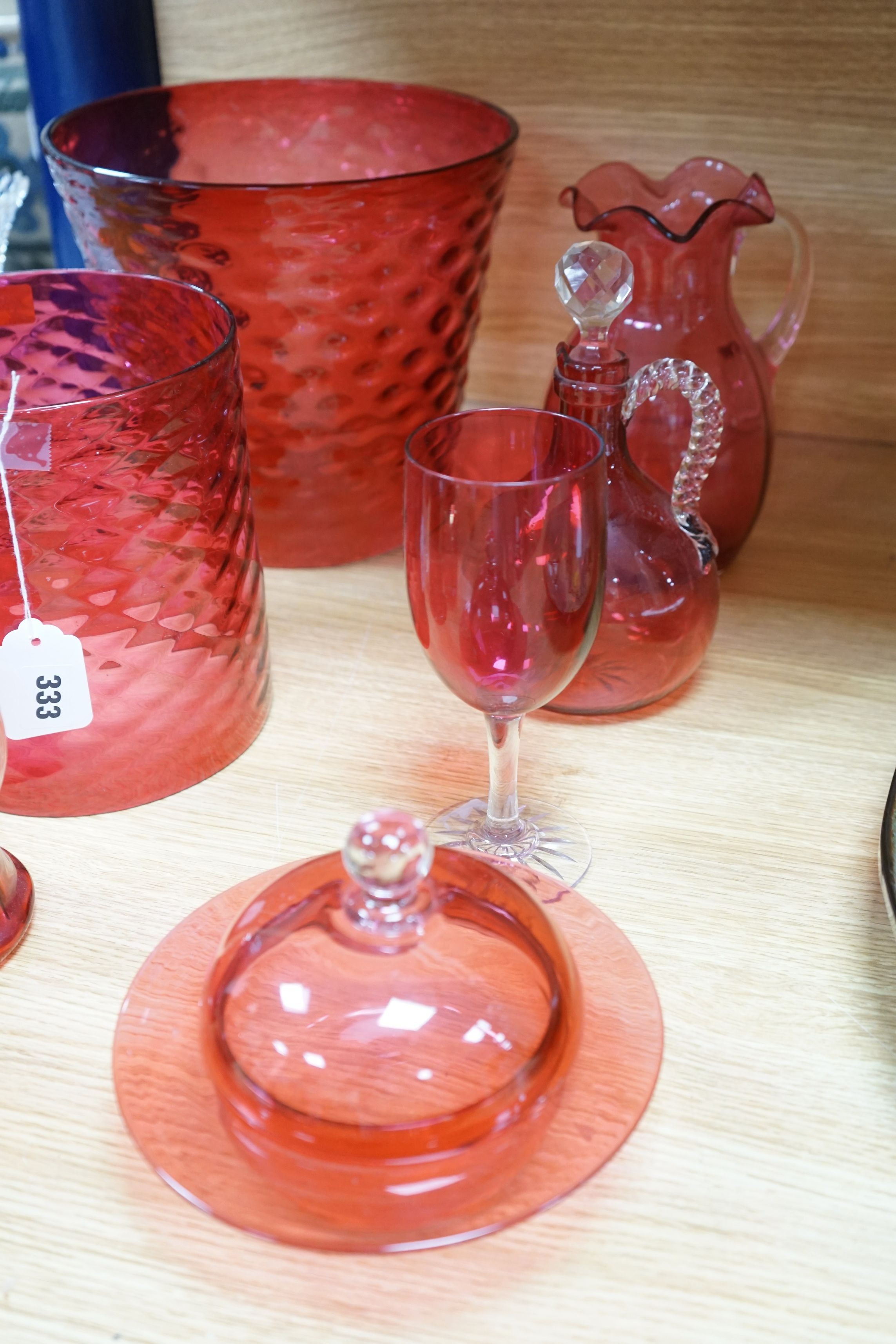 Three cranberry glass shades together with mixed cranberry and other glass, tallest shade 23cms high